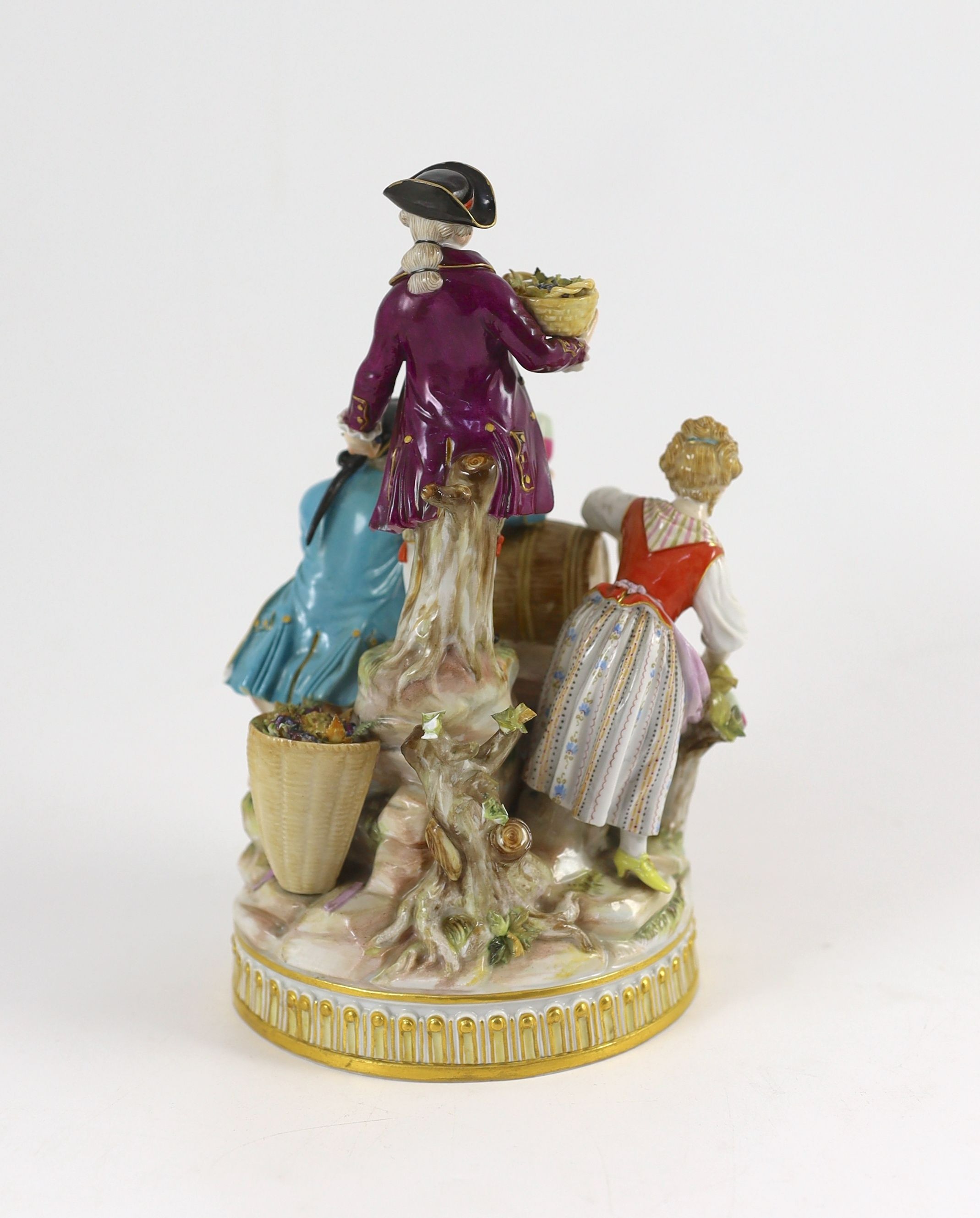 A Meissen group of the three winemakers, 19th century, after a model by Michel Victor Acier, 21 cm high